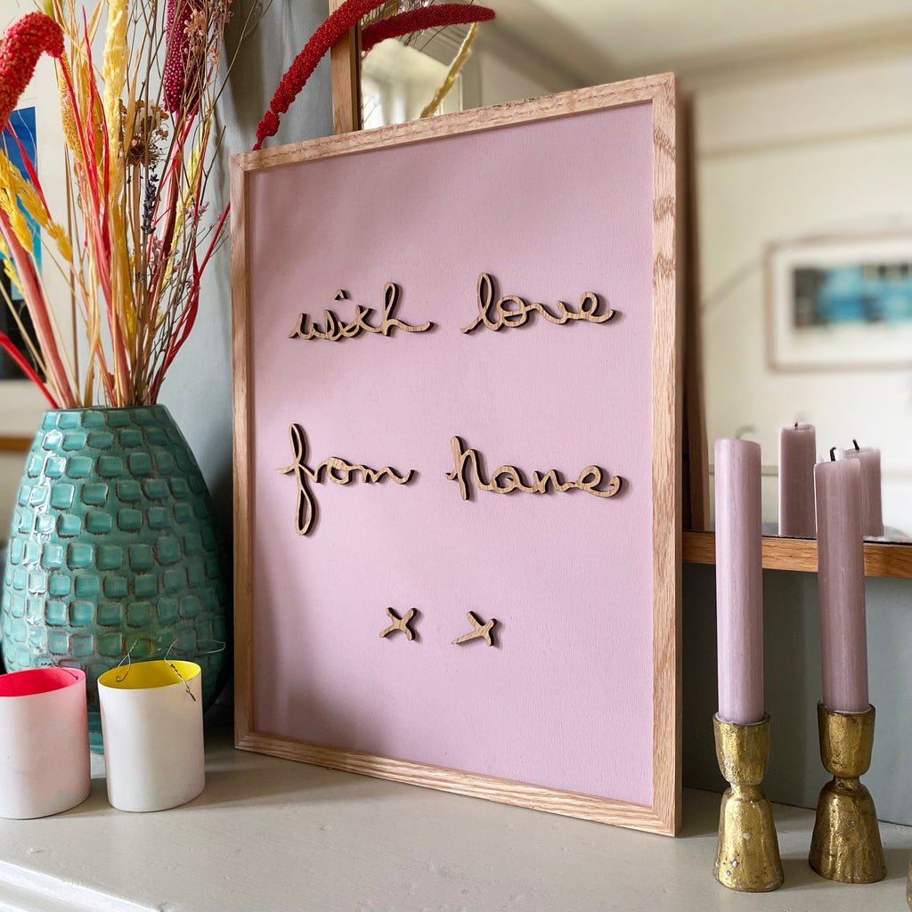 hand written wooden lettering unique to each piece. on a hand painted muted pink wooden backdrop