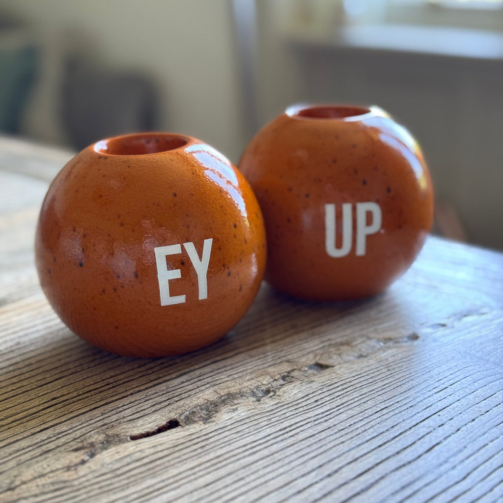 EY UP orange candle holders 