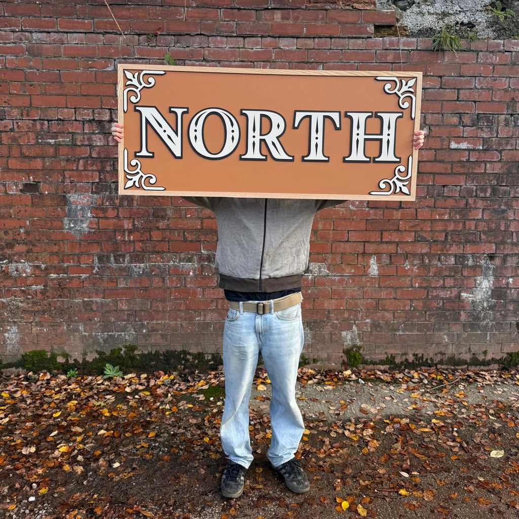 north wooden painted sign in style of barge signwriting