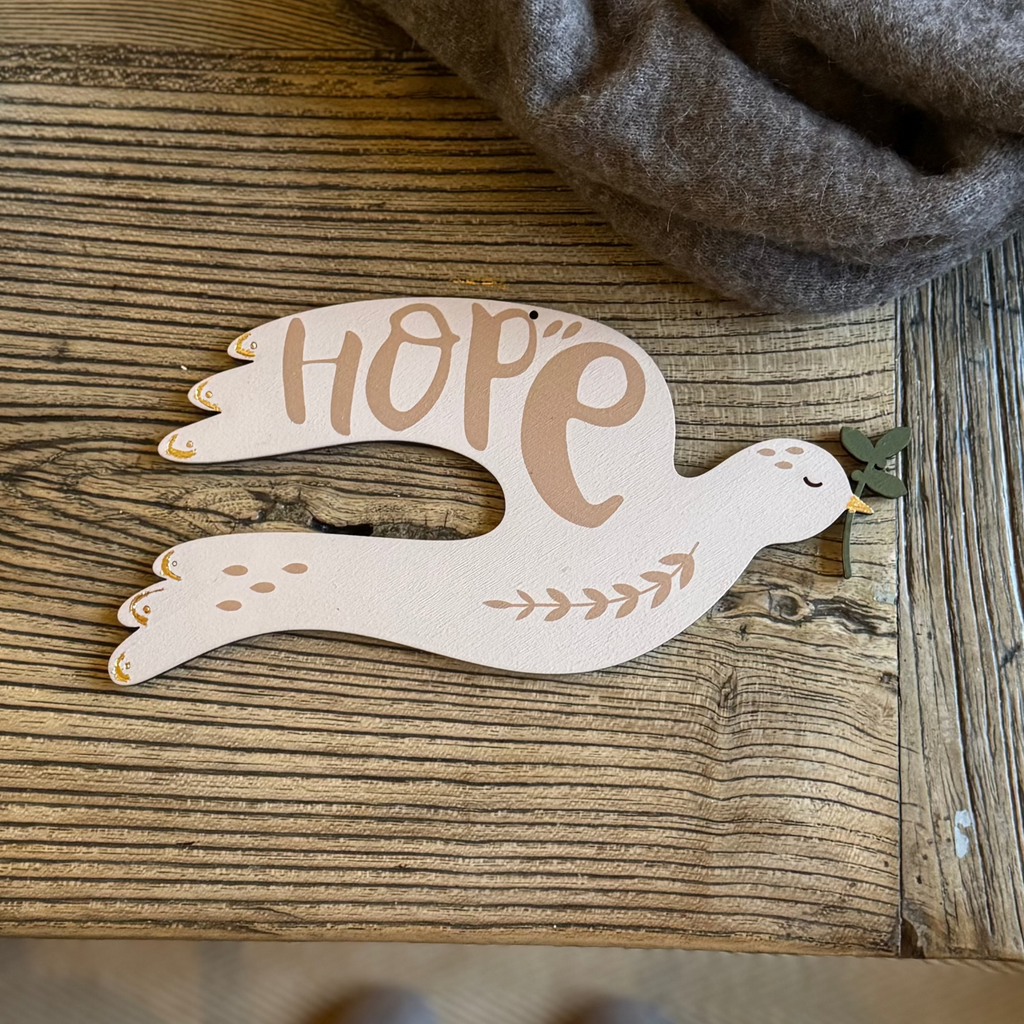 wooden peace dove for christmas painted in pale pink with gold details by modo
