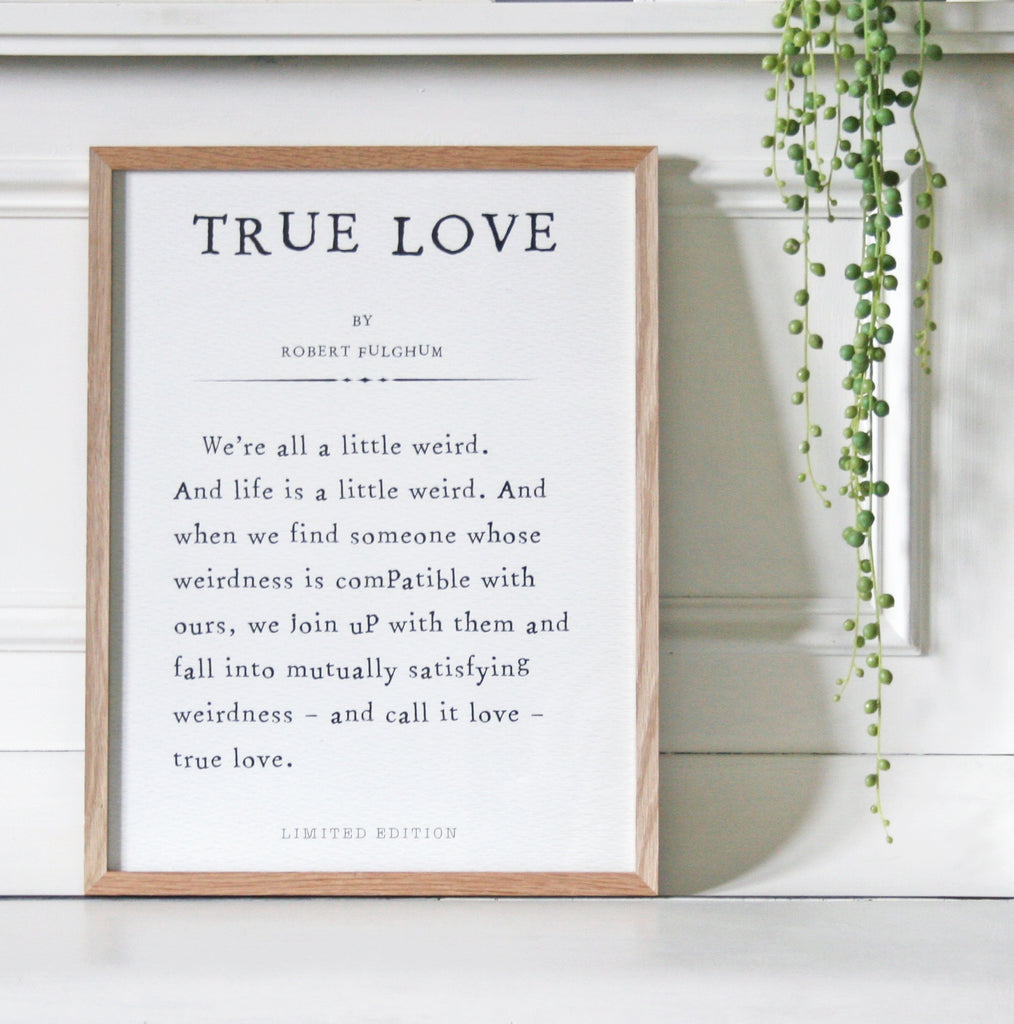 print with type writer font showing a passage from a particular story. wooden frame around paper print
