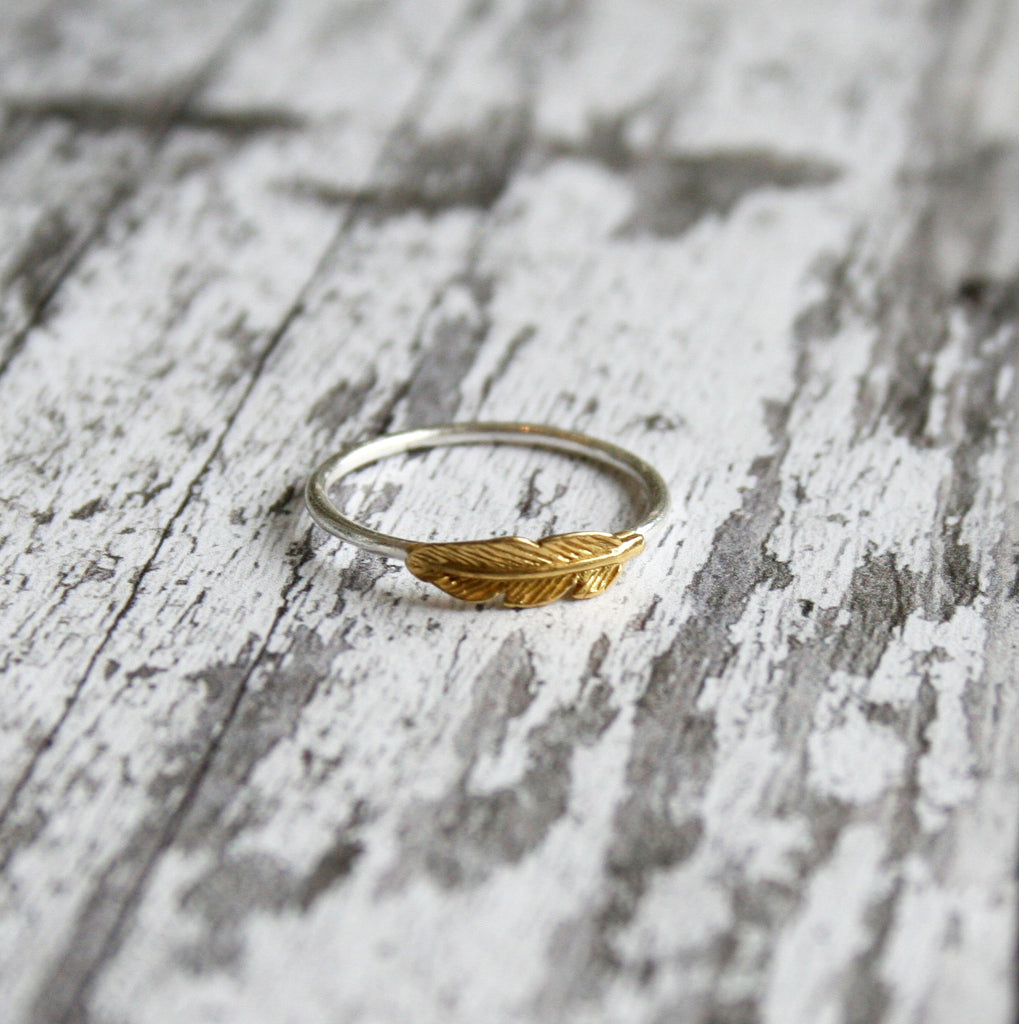 pretty, dainty silver ring with golden feather 