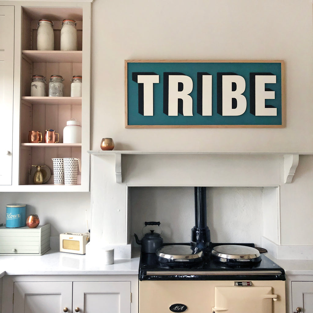 Tribe word art wooden sign transforming kitchen. Hanging above Aga cooker. Modern kitchen design. Skimming stone Farrow and Ball, Setting Plaster